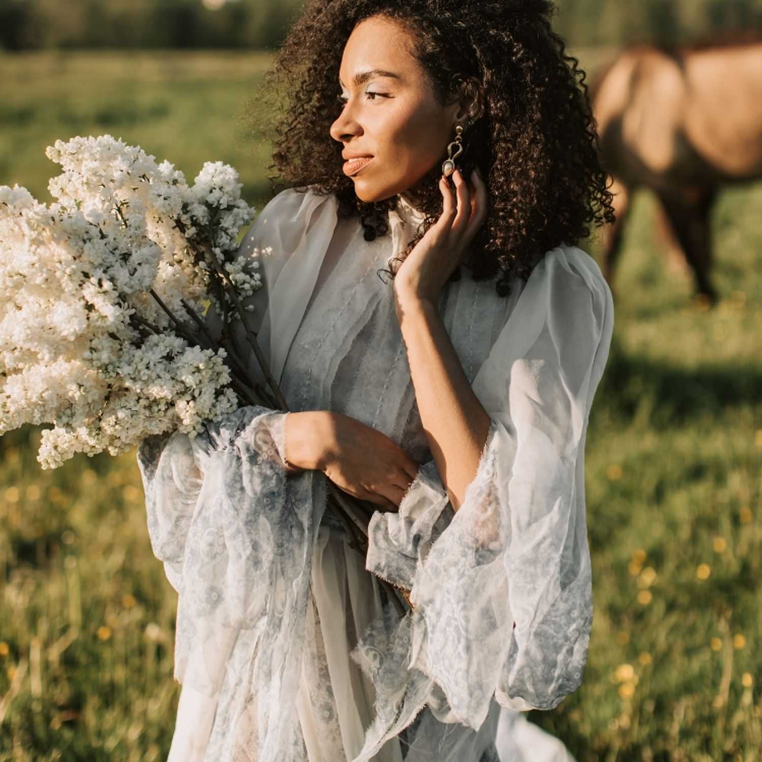 Portrait of Alix, a professional stylist at Ivy & Vine Beauty Haven, showcasing their expertise and style.